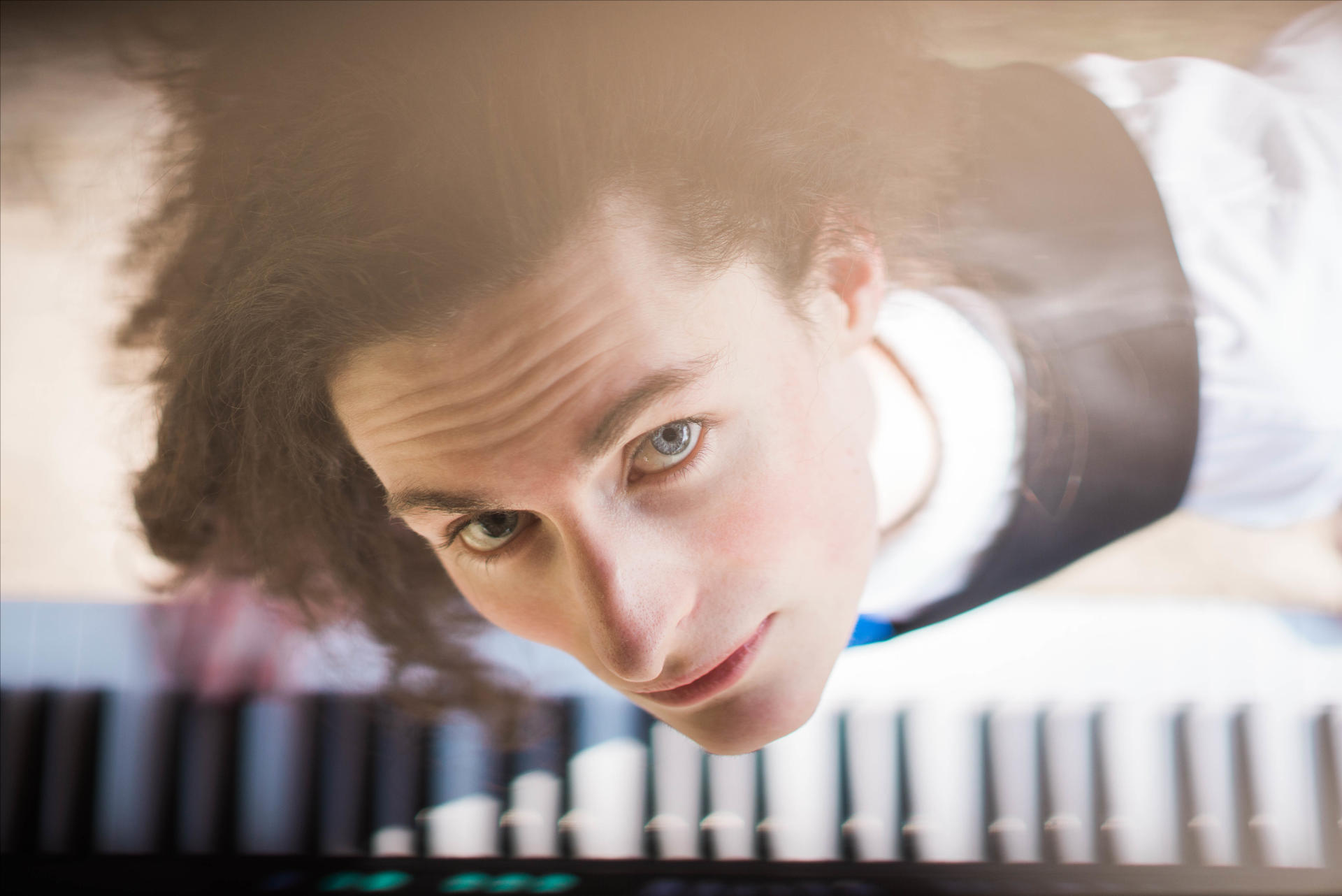 trevor smiling up from his keyboard