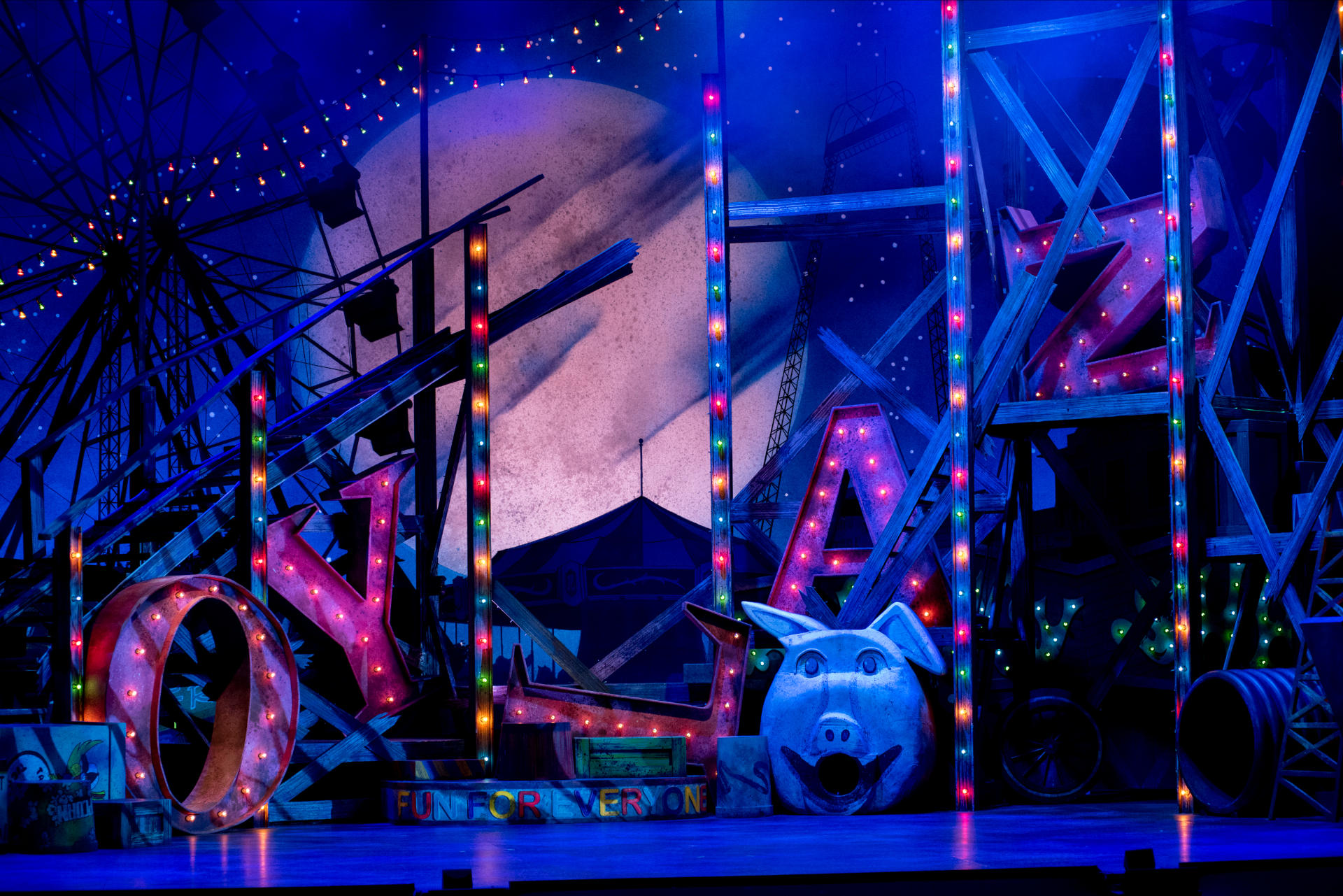 The set consisted of a huge rollercoaster with letters over 6' tall each spelling Joyland scattered throughout. There were an assortment of amusement park themed scenery supersized to scale with the cats.