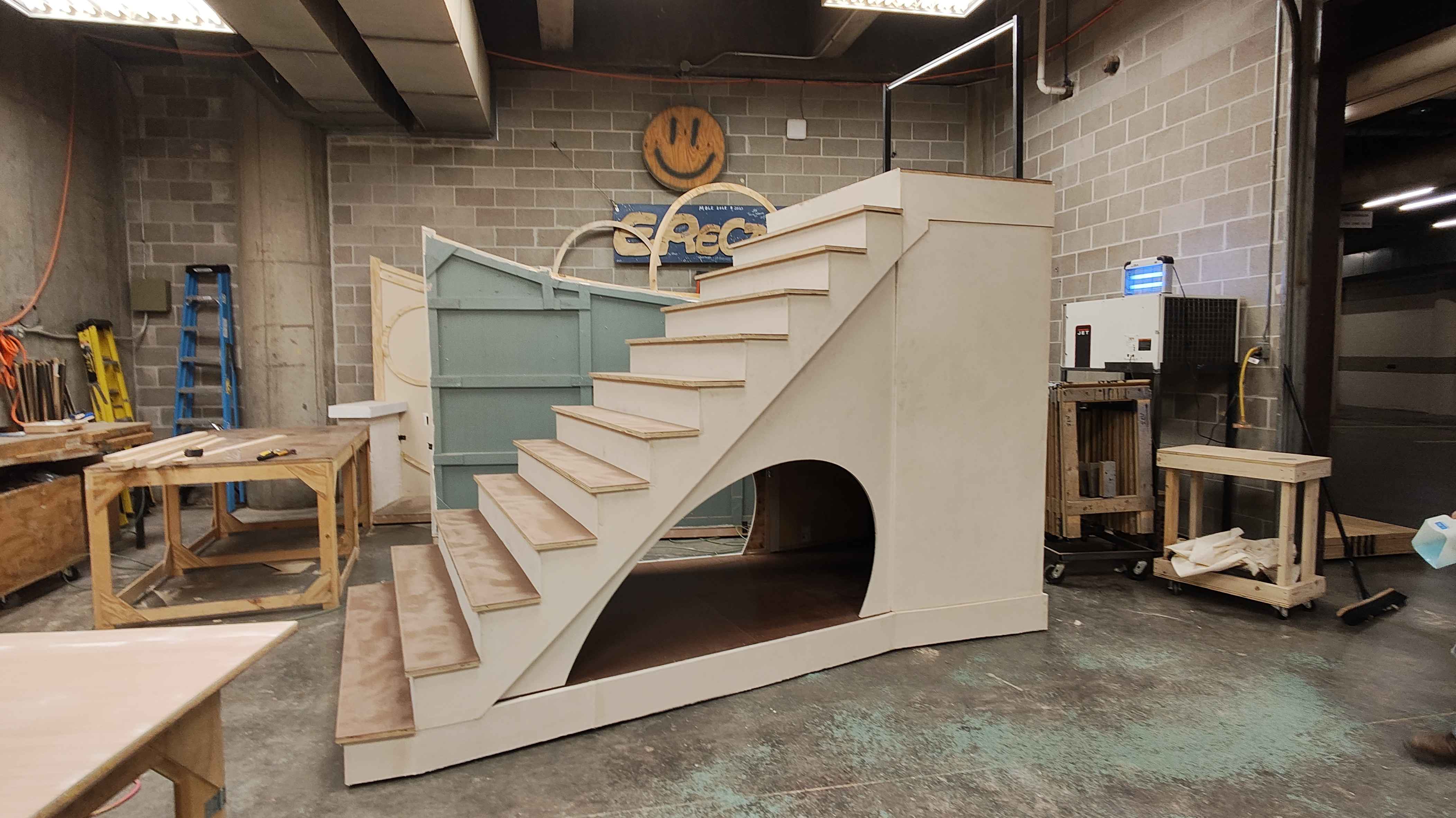 Large rolling staircase unit with trap door used in 'Let It Go'