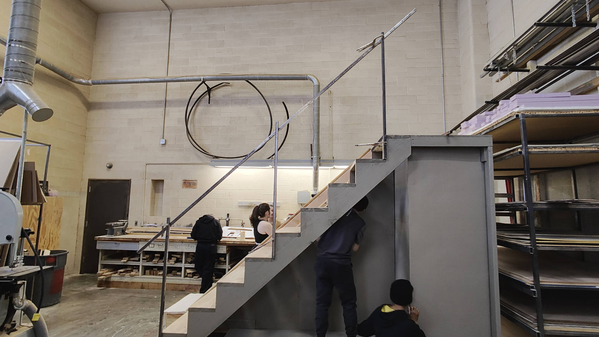 Dry-fitting railing made of 1-inch steel square tubing on the stair unit.
