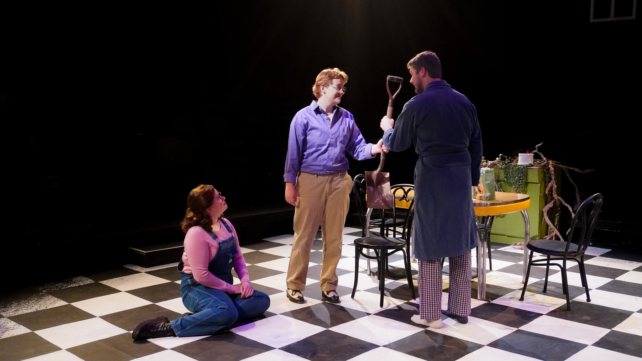Samuel (Fio Willis) hands his father, Johnny (Ian Moore), a shovel while Beauty (Mia Dennett) watches.