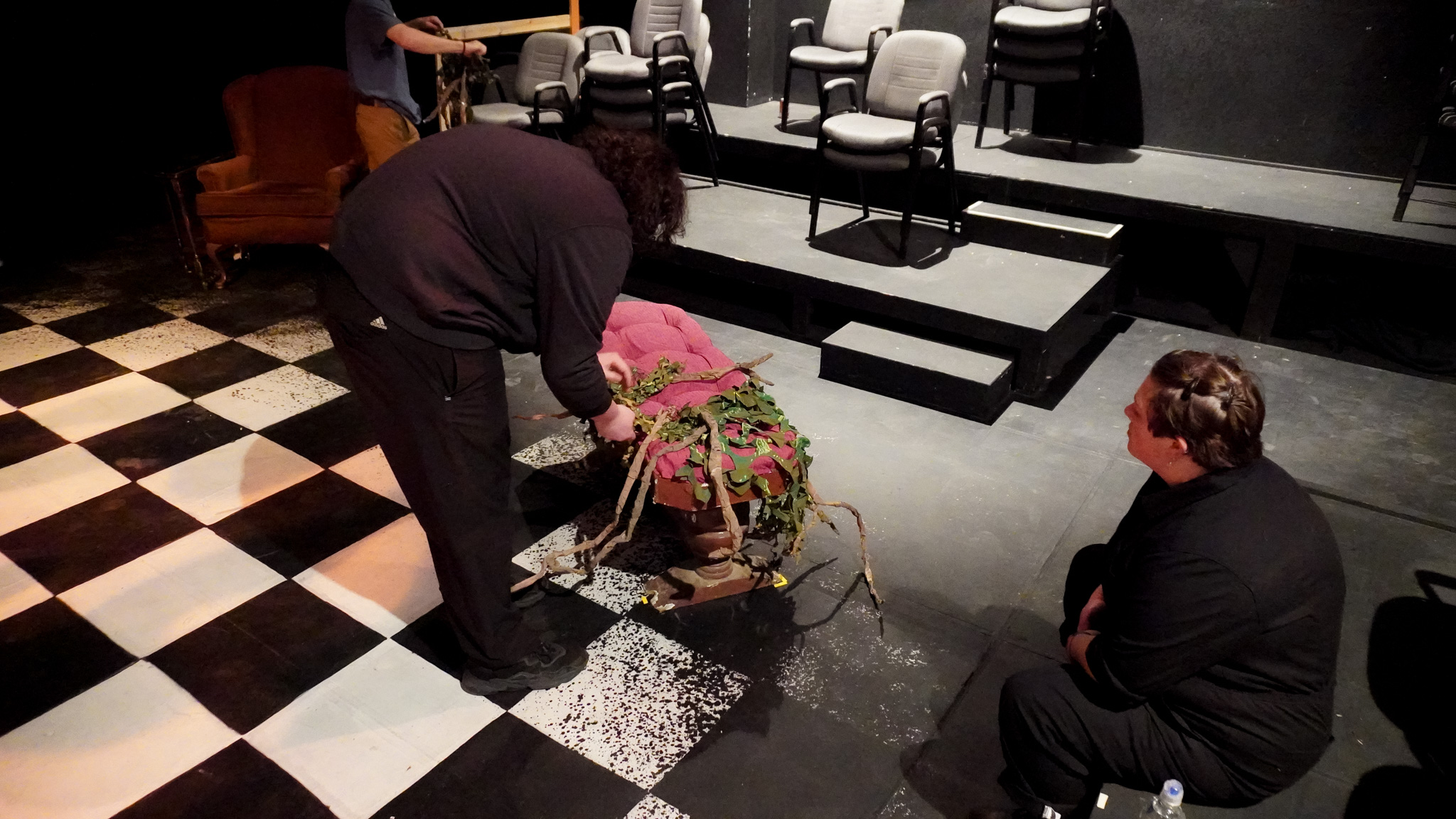 Technicians figure out how to dress the set for act three.